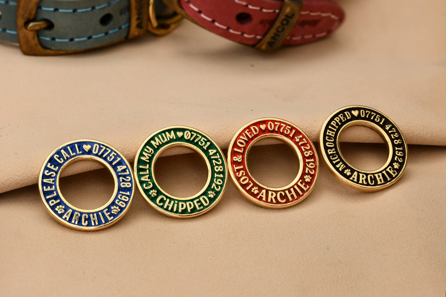 Hoop-shaped brass ID tag with deep custom engraving, handmade in the UK. Suitable for dogs, cats, and horse bridles, shown attached to a collar for display.