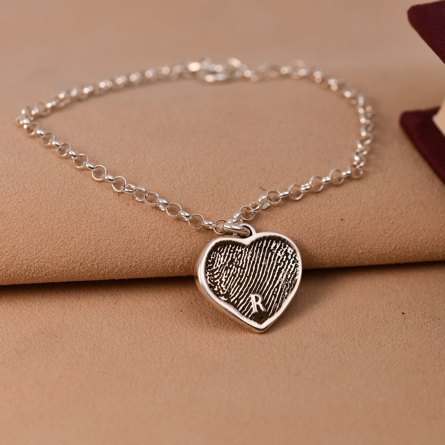 Sterling silver artisan fingerprint heart bracelet with a full fingerprint filling the heart