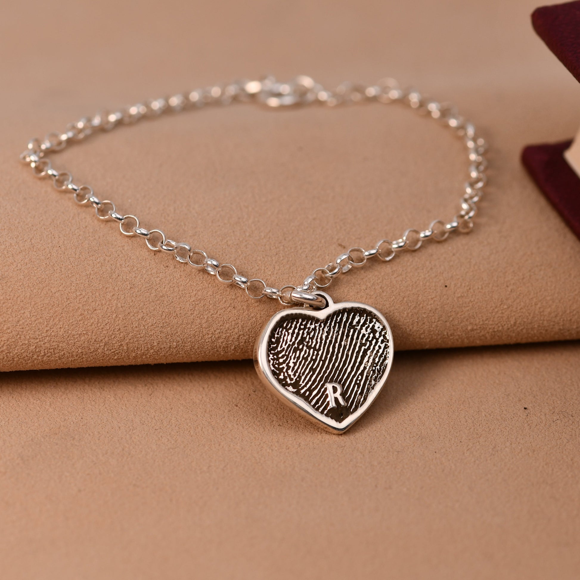 Sterling silver artisan fingerprint heart bracelet with a full fingerprint filling the heart