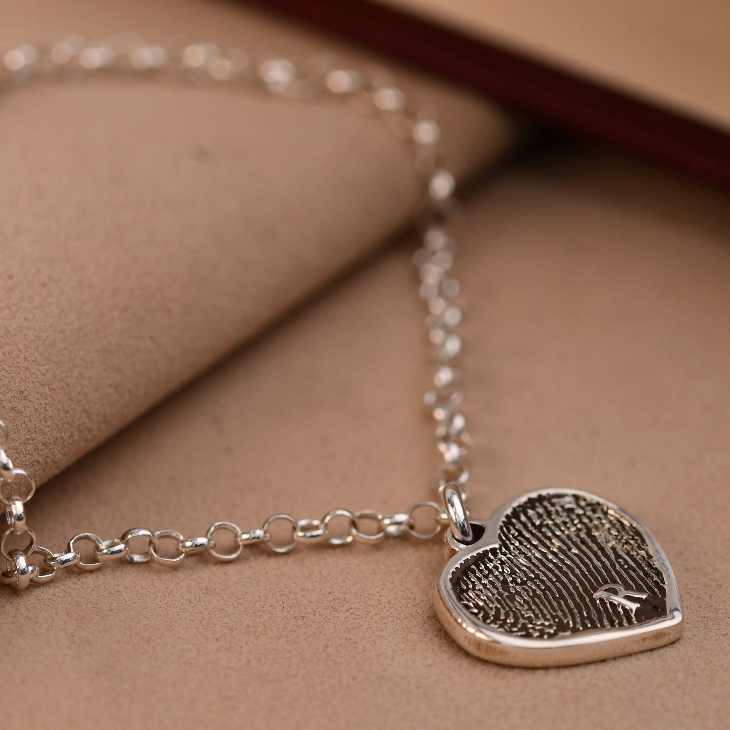Artisan fingerprint heart bracelet with a full fingerprint and an engraved initial