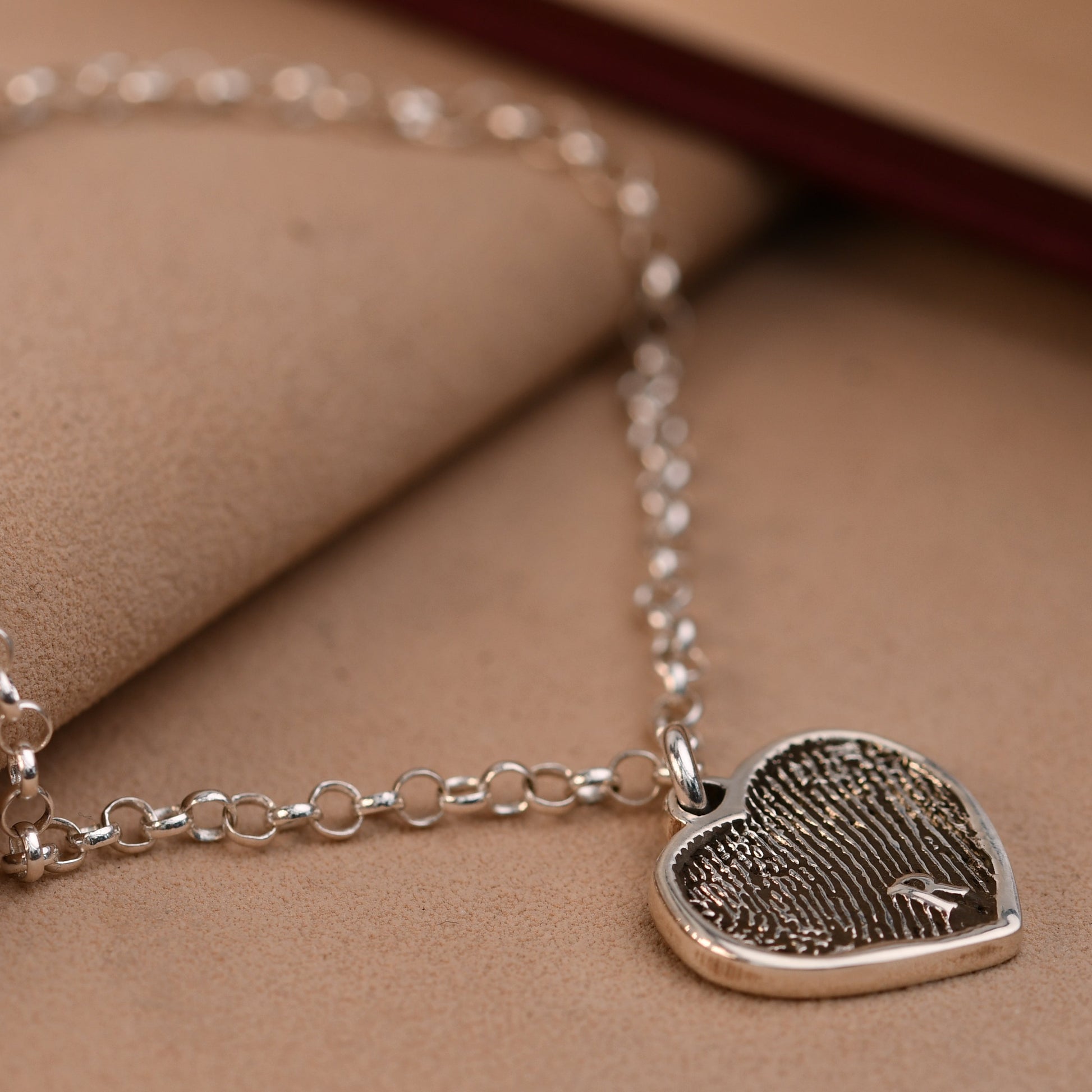 Artisan fingerprint heart bracelet with a full fingerprint and an engraved initial
