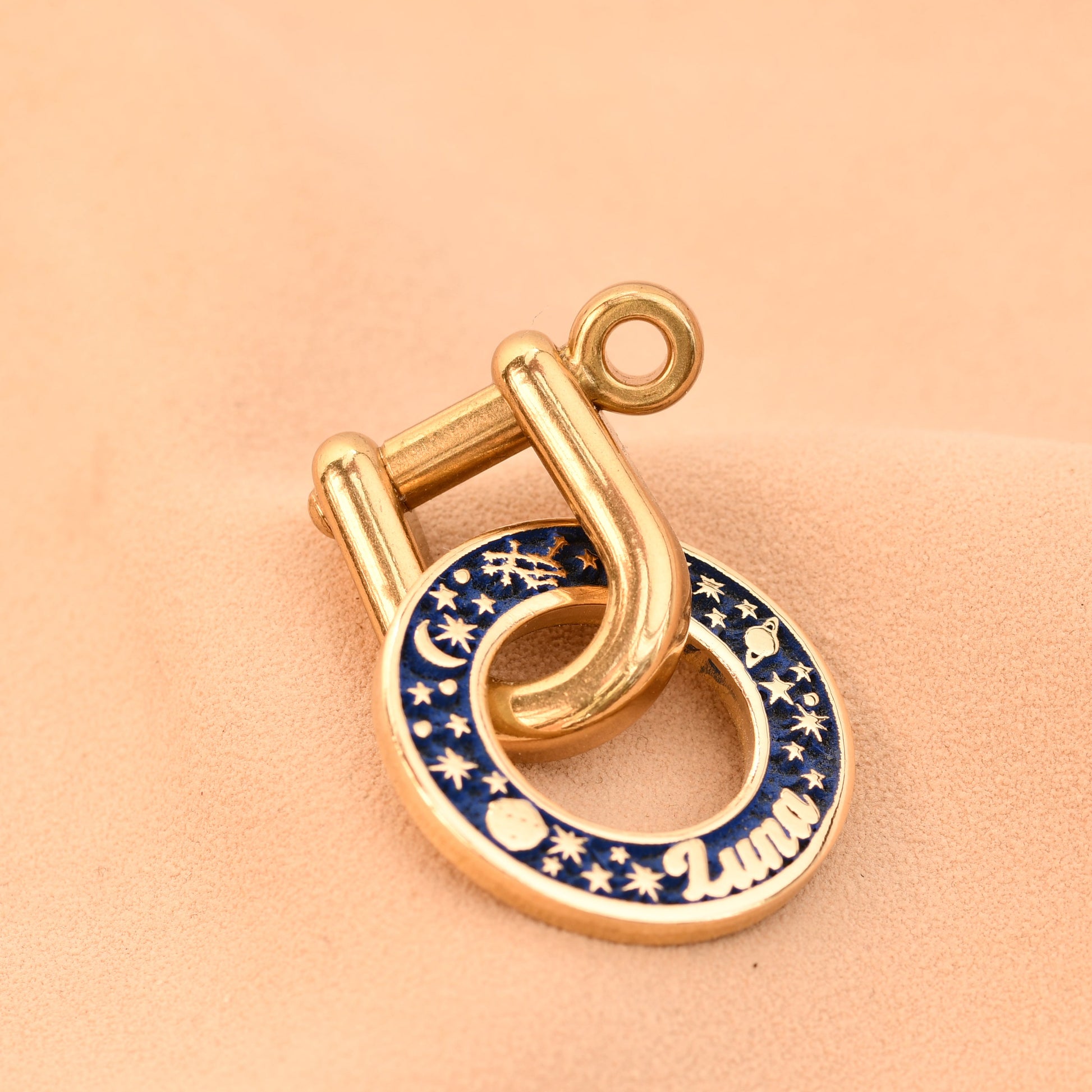 Gold and blue decorative lock on a beige background