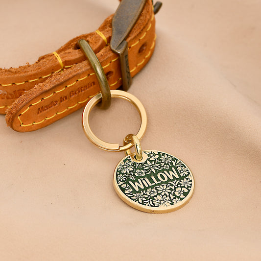 Floral brass dog tag with one-word engraving Willow surrounded by flower pattern in red