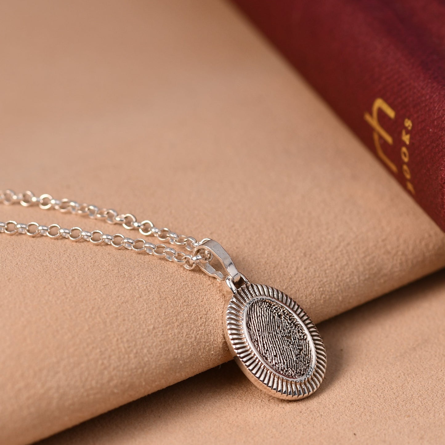 Oval fingerprint necklace with a fingerprint and a small engraved initial